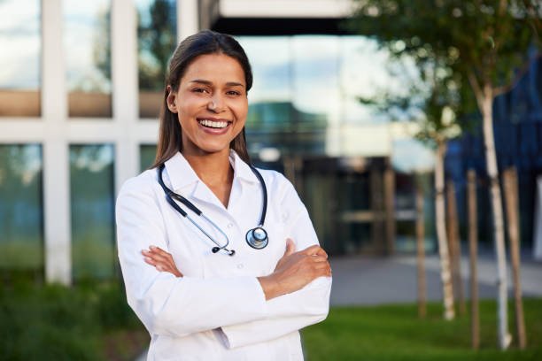 Smiling female doctor outside a modern clinic
